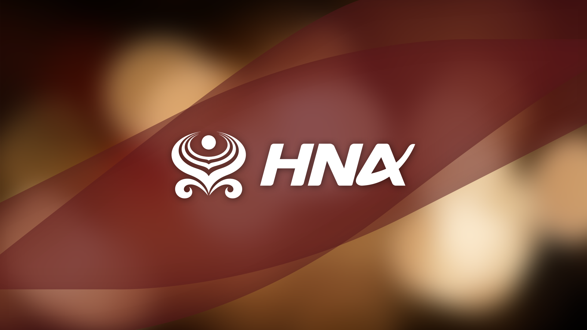 The opening screen of the IFE showing the HNA group logo on a red background with gold bokeh behind it.